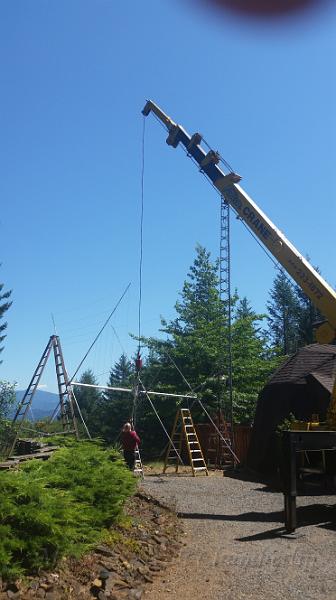 20150728_141950.jpg - Sandy hooking of a crane to lift the antenna to the top of the tower.