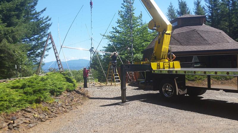 20150728_142039.jpg - Sandy and Marc getting ready to lift the antenna to the top of the tower.