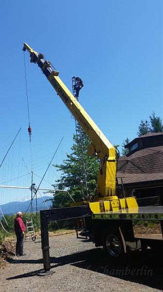 20150728_143745.jpg - Marc getting the antenna rotator ready to receive the antenna.